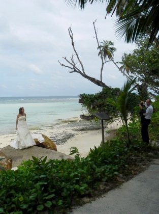 Newly wedded couple taking pictures at the Hilton resort on Silhouette